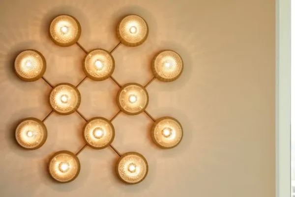 Nuura Liila 12 vägg-/taklampa, guld - klar